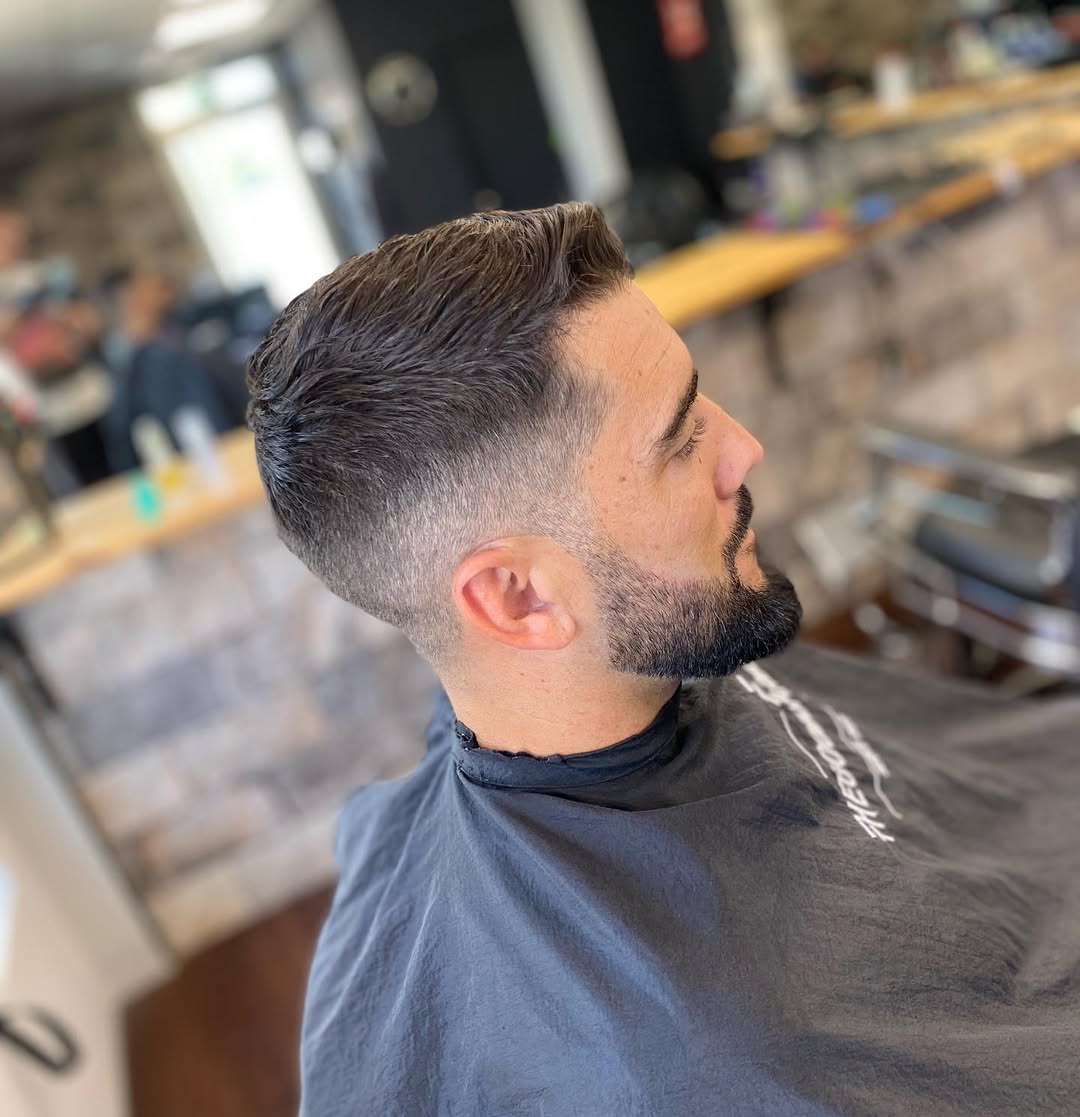 Corte degradado (fade) moderno en The Good Barber